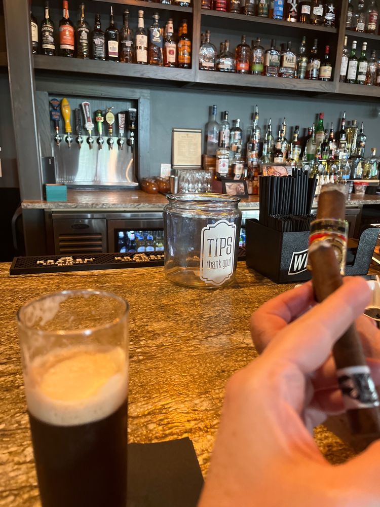 Wilde Cigars full bar with backlit bottle display